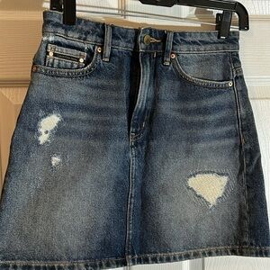 Calvin Klein Jeans distressed denim skirt.